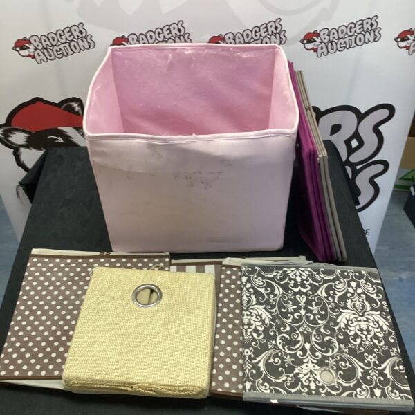 Quantity of neutral fabric storage boxes for home organisation.