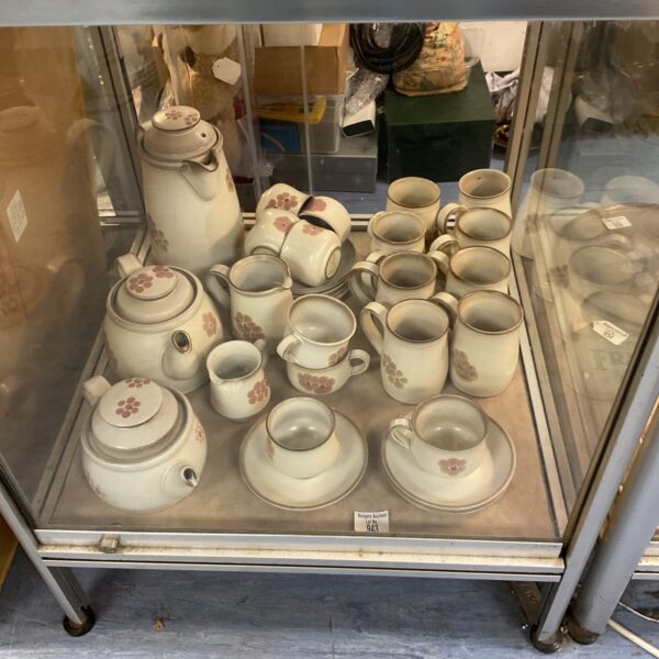 Vintage Denby Gipsy Range tea set displayed in a cabinet.