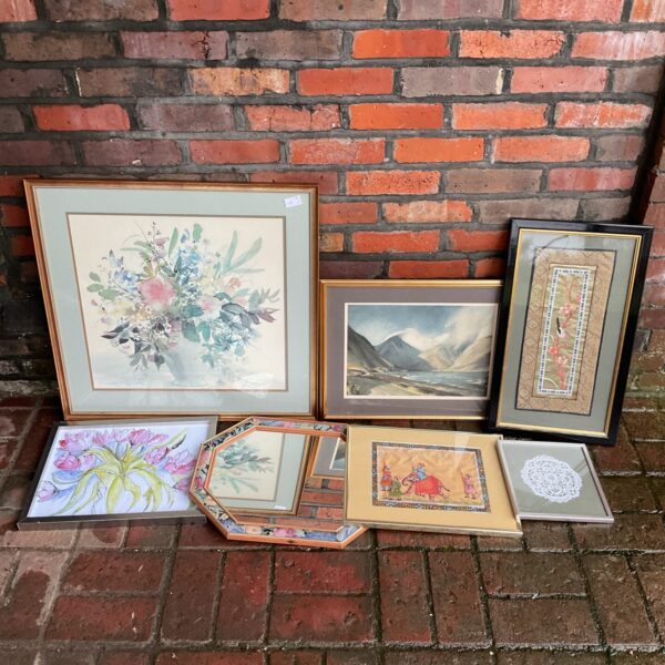 Collection of vintage framed prints and artwork for home decor.