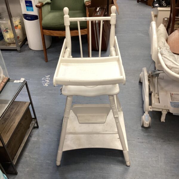 Vintage wooden high chair with slatted back and seat.