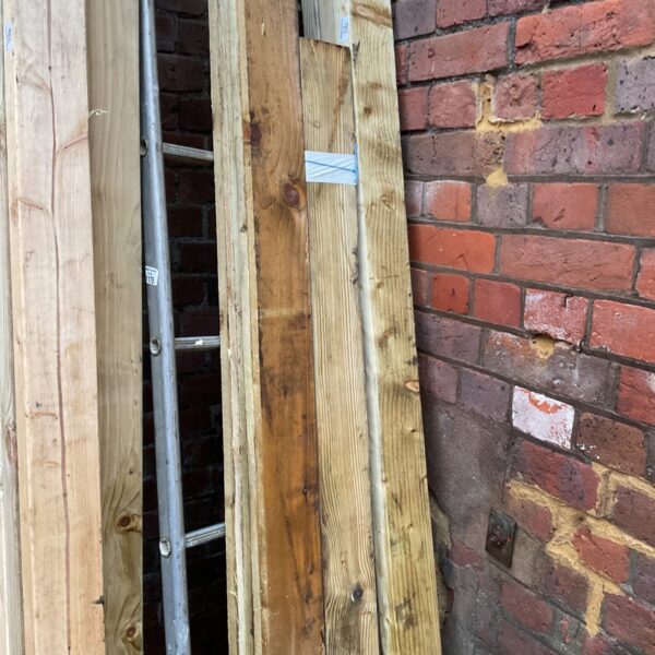 Stack of softwood timber bundles for DIY projects.