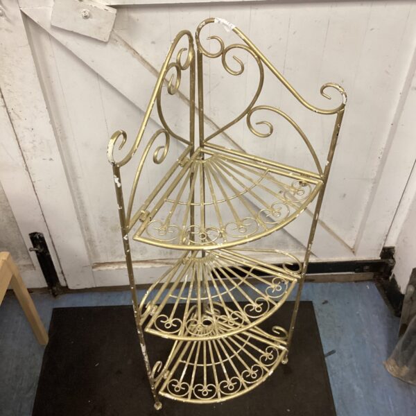 Gold vintage folding plant stand with three tiers.
