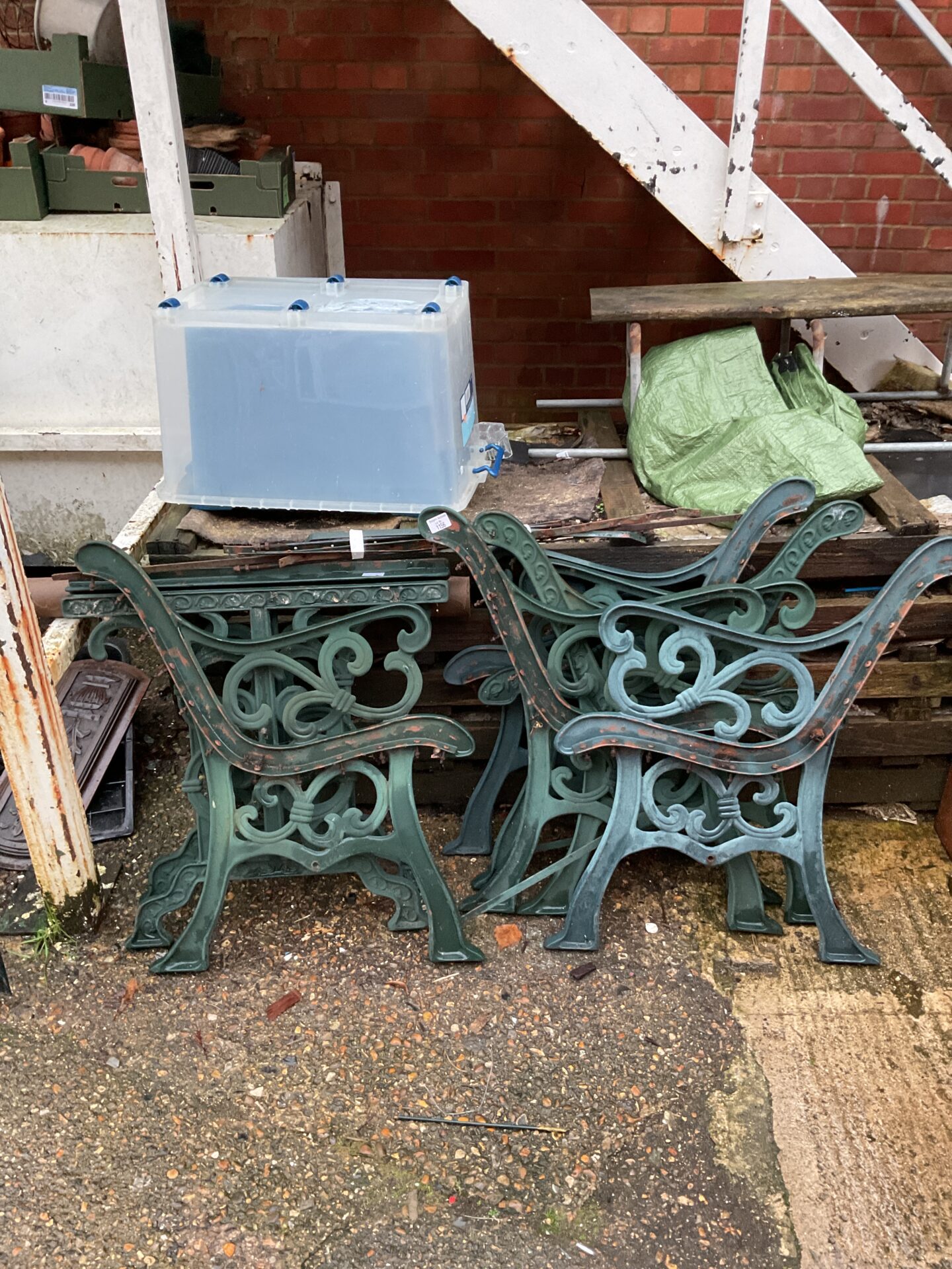 1156 Three pairs of cast iron bench ends & pair of table ends