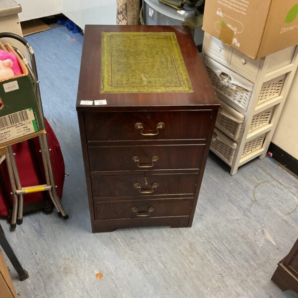 Vintage leather top chest of drawers with wooden construction.