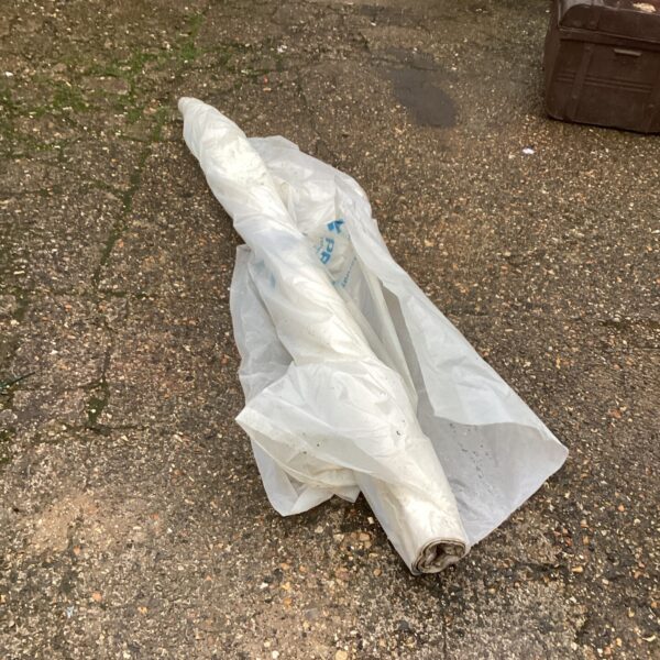 Large roll of industrial polythene sheeting for construction projects.