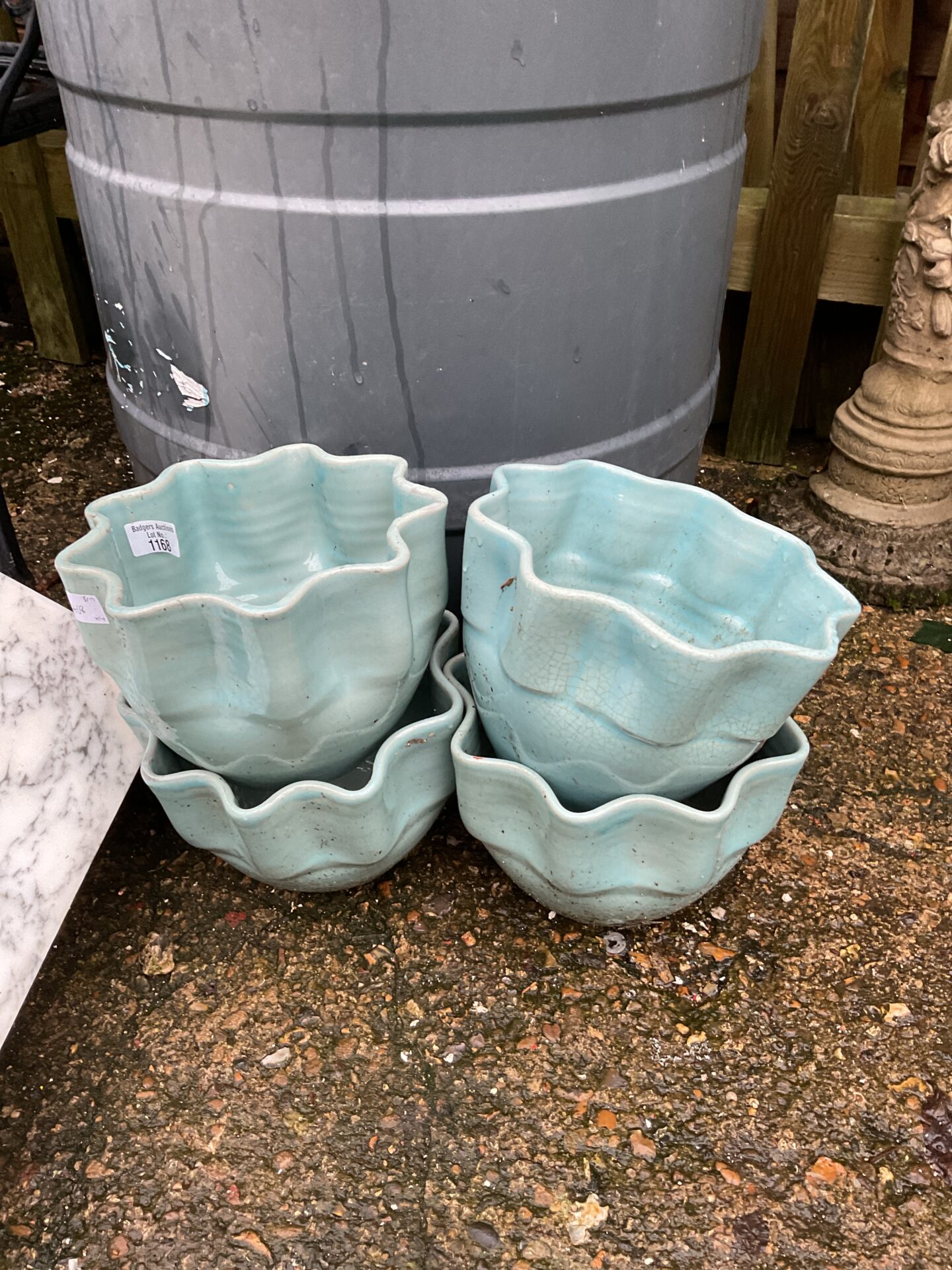 1168 Four ruffle edged turquoise garden pots