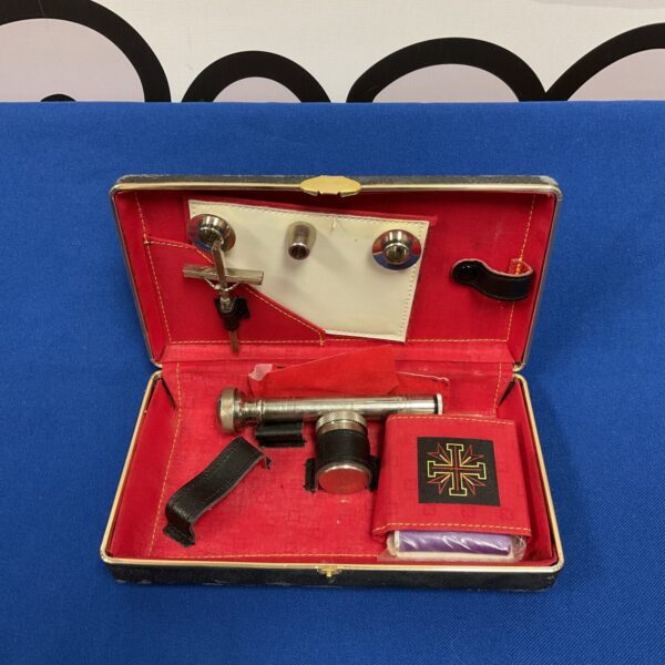 Open vintage communion set showing chalice and paten.