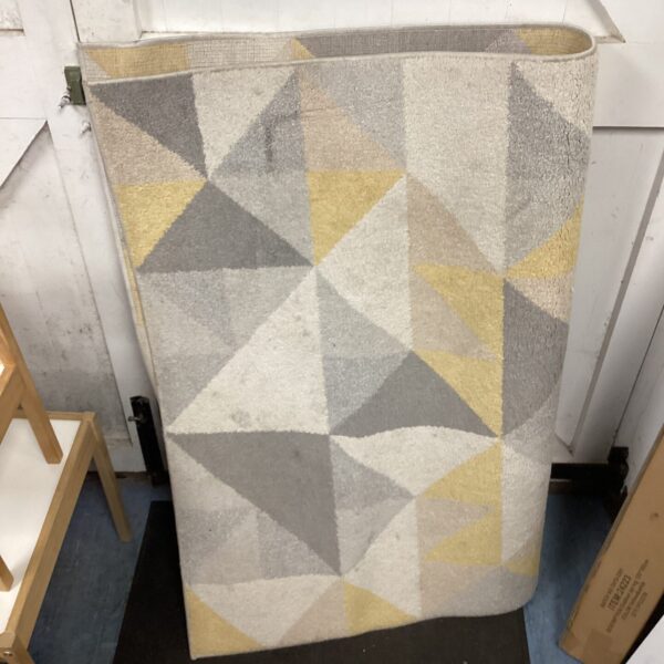 Grey and cream geometric patterned Dunelm rug for living room.