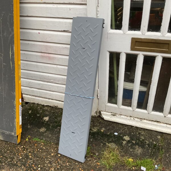 Pair of metal car ramps for vehicle maintenance and repair.