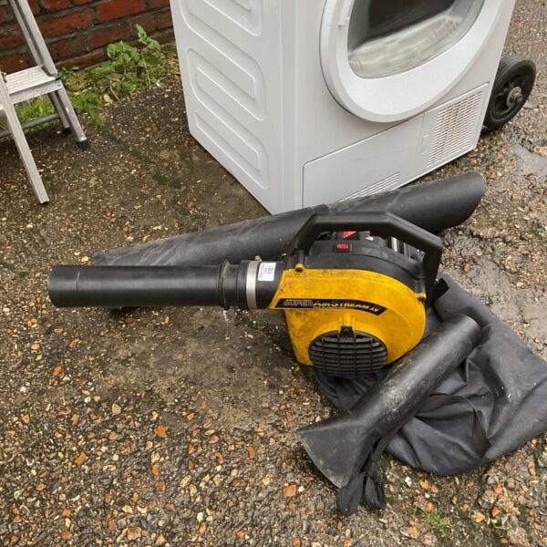 Used McCulloch petrol blower vac for garden cleanup.