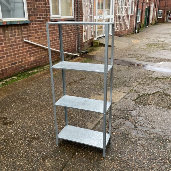 Galvanised metal shelving unit with four tiers for storage.