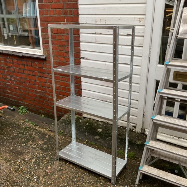 Galvanised metal shelving unit with four tiers for storage.