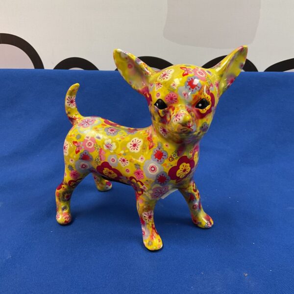 Colourful Pomme Pidou chihuahua money box with floral design.