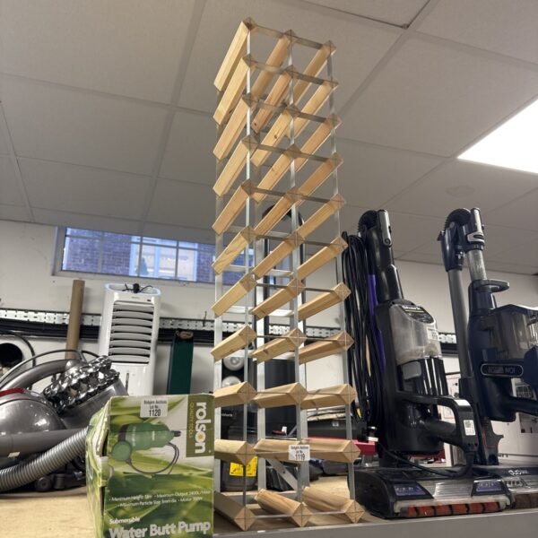 Tall metal and wood wine bottle rack for display.