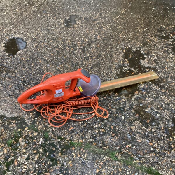 Used Flymo electric hedge cutter for garden trimming and maintenance.
