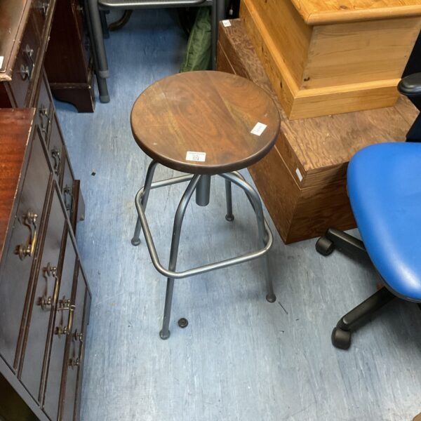 Vintage adjustable school stool with metal base and swivel seat.
