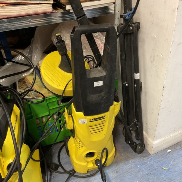 Karcher K2.300 pressure washer with patio cleaner attachment for garden cleaning.