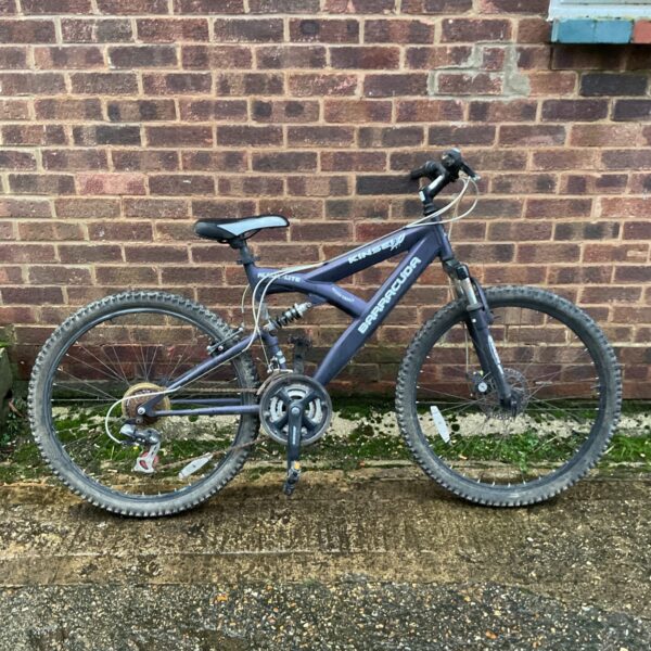 Black and silver Kinsei Baracuda mountain bike in used condition.