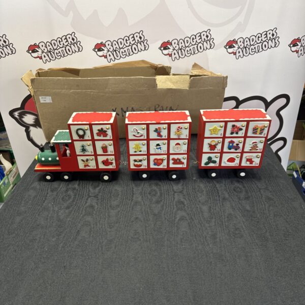 Full view of a wooden advent train Christmas decoration.