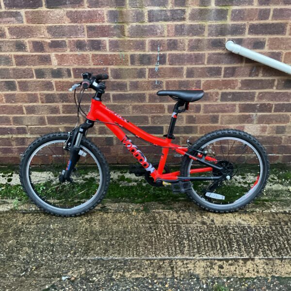 Red Voodoo childs bike with front suspension for young riders.