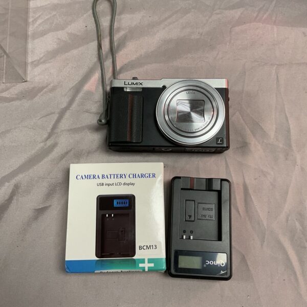 Panasonic Lumix DMC-T270 digital camera with charger.