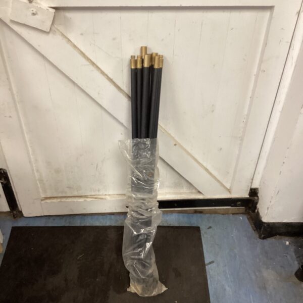 Set of bundled drain rods for clearing blocked pipes.