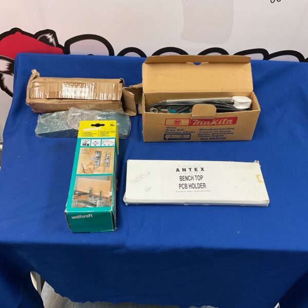 Makita angle drill and tool set for workshop projects.