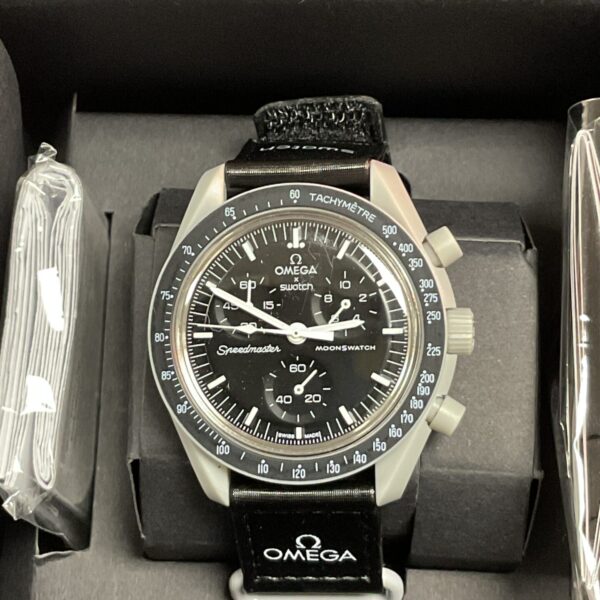 Front view of the black Omega Swatch Moonwatch bioceramic watch.