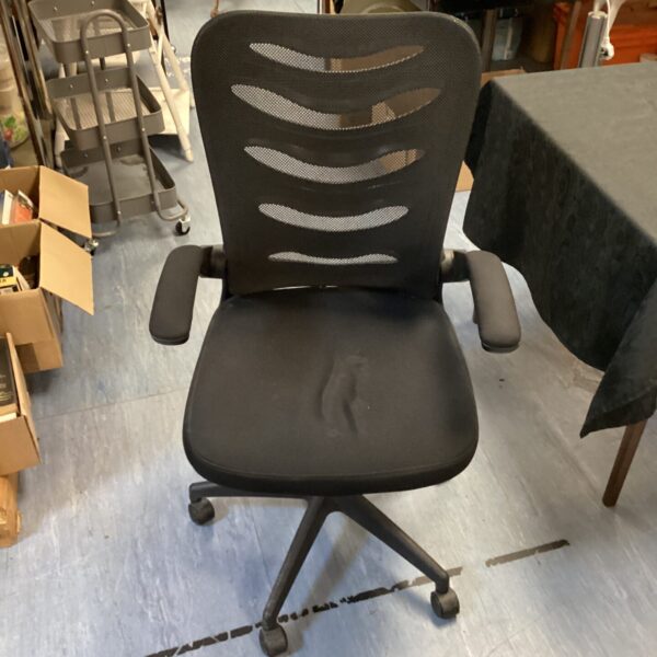 Black mesh ergonomic office chair with swivel base.