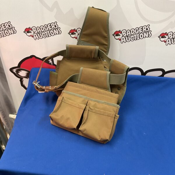 Vintage builders tool belt with back support for construction work.
