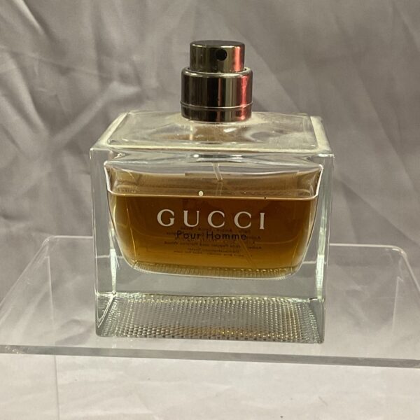 Front view of a partially used Gucci perfume bottle.