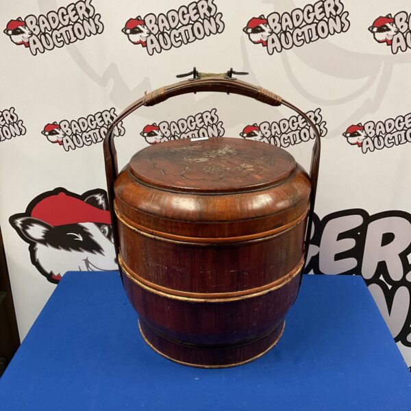 Vintage Chinese picnic basket with tiered sections and bamboo handle.