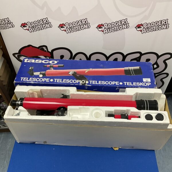 Vintage Tasco telescope in its original box with tripod.