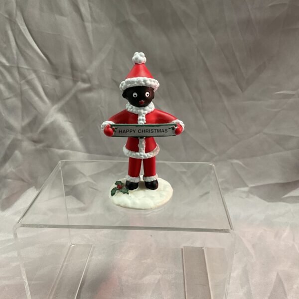 Vintage golly Santa cake topper, a charming Christmas collectible.