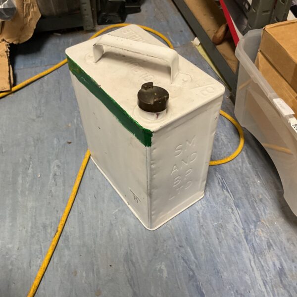 Vintage metal fuel can with handle and cap.