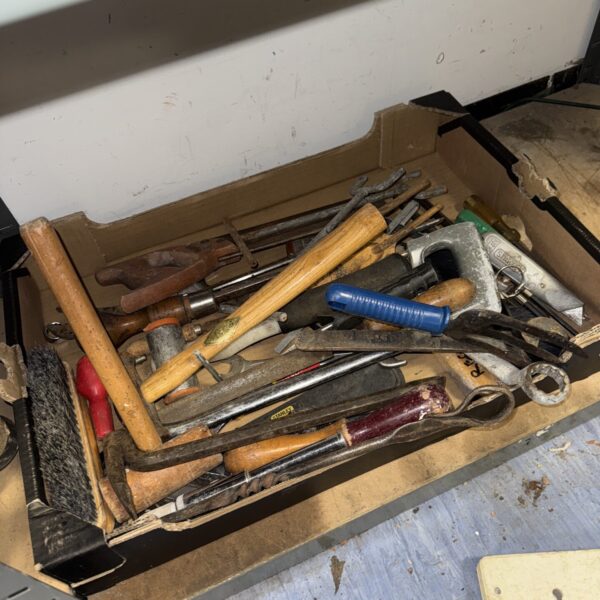 Tray of assorted vintage hand tools for workshop or collection.