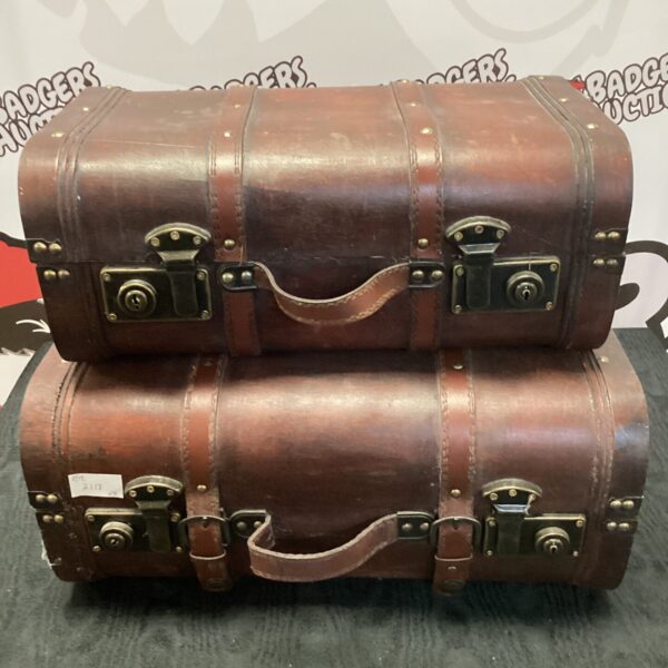 Pair of antique brown leather travel cases.