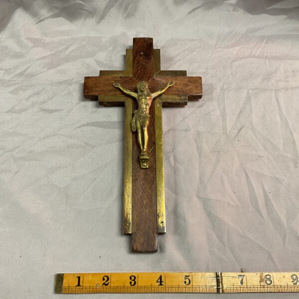 Vintage wooden crucifix with brass corpus for wall display.