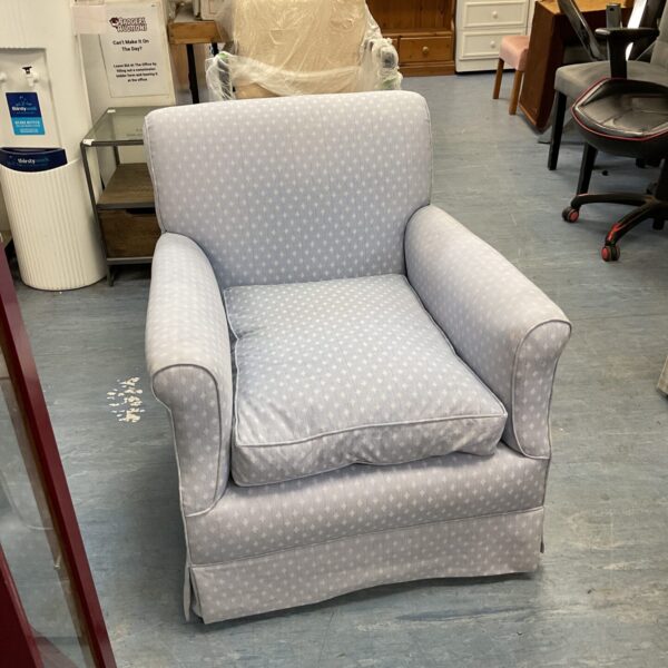 Reupholstered Victorian armchair with patterned fabric in a room setting.