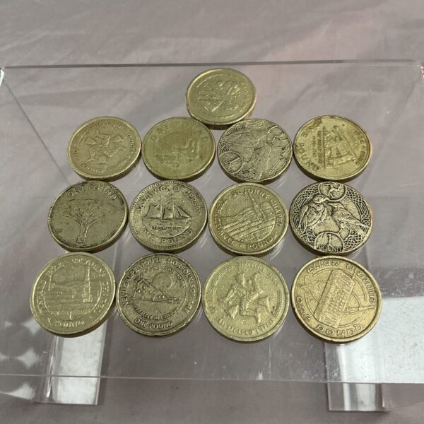 Collection of thirteen circulated £1 coins from the UK.