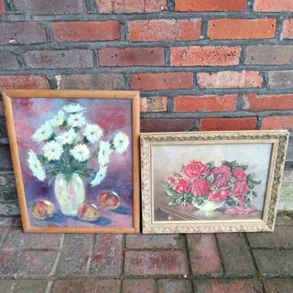 Vintage oil painting of white daisies and peaches in a still life arrangement.