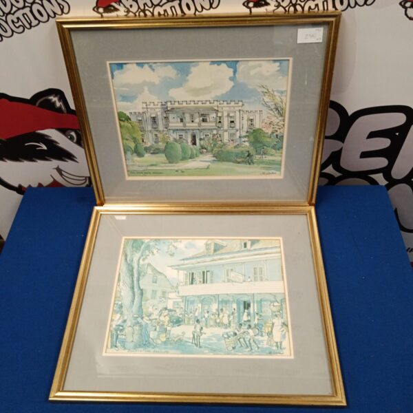 Pair of gilt-framed Jill Walker Barbados prints for wall decor.