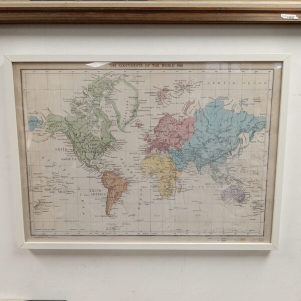Antique 1881 world map in a decorative frame, vintage cartography.