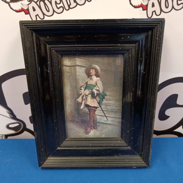 Vintage musketeer print in a black lacquered frame, antique wall art.