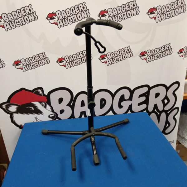 Black adjustable guitar stand for instruments.