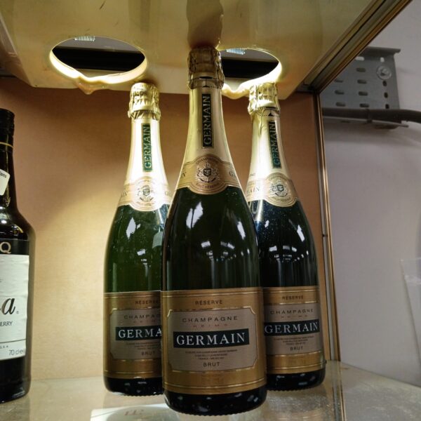 Lot of three bottles of Germaine Champagne Brut sparkling wine.