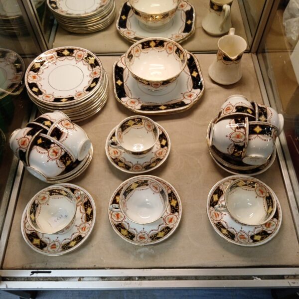 Antique W L Diamond Court teaset with floral design.