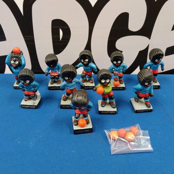 Vintage Robertson's Golly football team figures displayed together.
