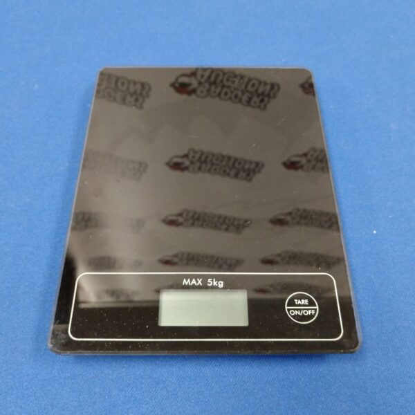 Close-up of digital kitchen scales showing the 5kg capacity.