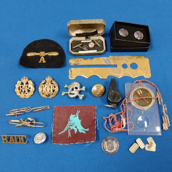 Mixed lot of vintage British military badges and insignia.